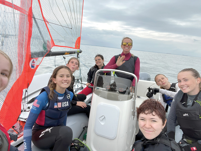 Youth sailing coach and young sailors on the water Youth sailing coach and young sailors on the water